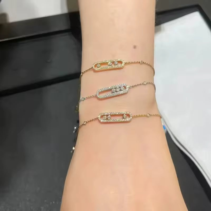 Elegant Gold Bangle Bracelet with Triple Stone Detail