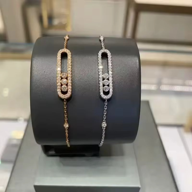 Elegant Gold Bangle Bracelet with Triple Stone Detail